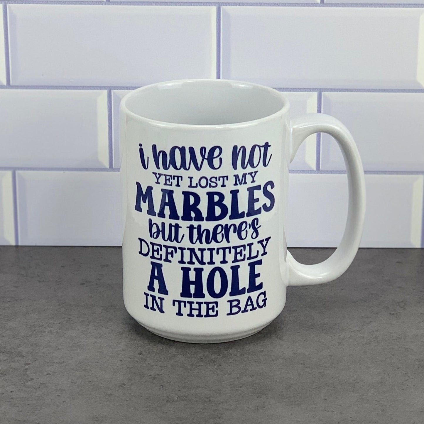 Have not lost marbles yet/hole in bag mug