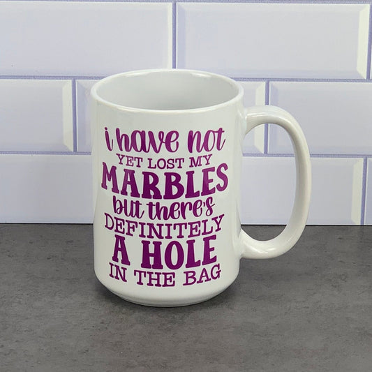 Have not lost marbles yet/hole in the bag mug